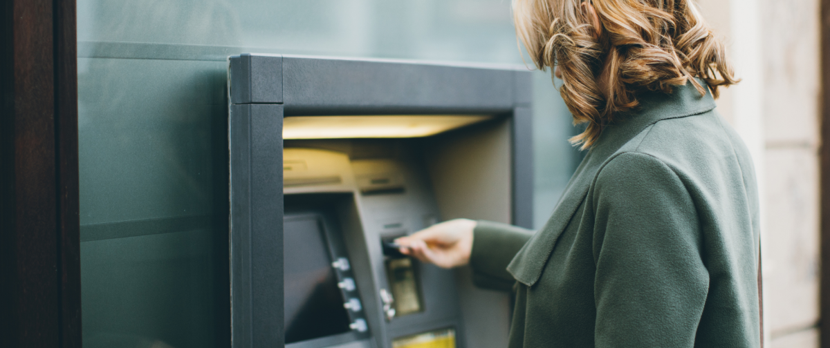 Woman using ATM